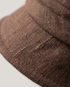 Macro close-up of slub-textured linen weave on Wildfool packable bucket hat