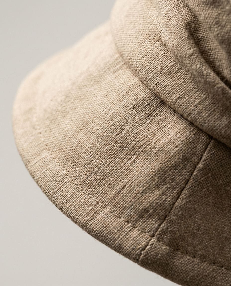 Wildfool 100% Linen Packable Bucket Hat in Khaki - Front View - Wired Brim, Fully Packable & Adjustable Fit