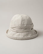 Side profile of Wildfool linen hat showing the upturned 5cm brim