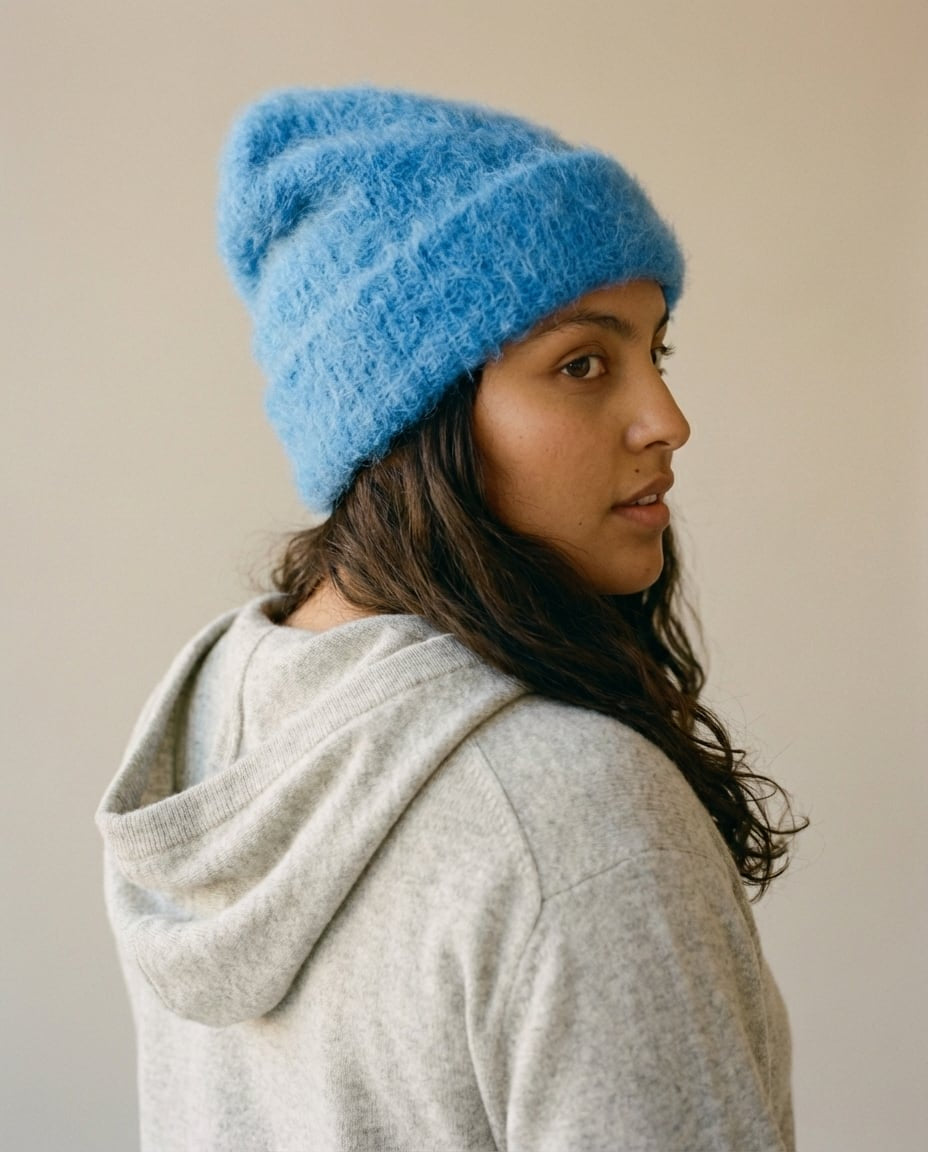 Wildfool alpaca beanie worn over a wool coat collar — lifestyle outdoor shot