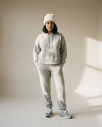 Suri alpaca beanie worn on model — three-quarter portrait in cold afternoon light