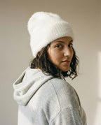 Wildfool Suri alpaca cloud beanie in fog — front view on cream linen background