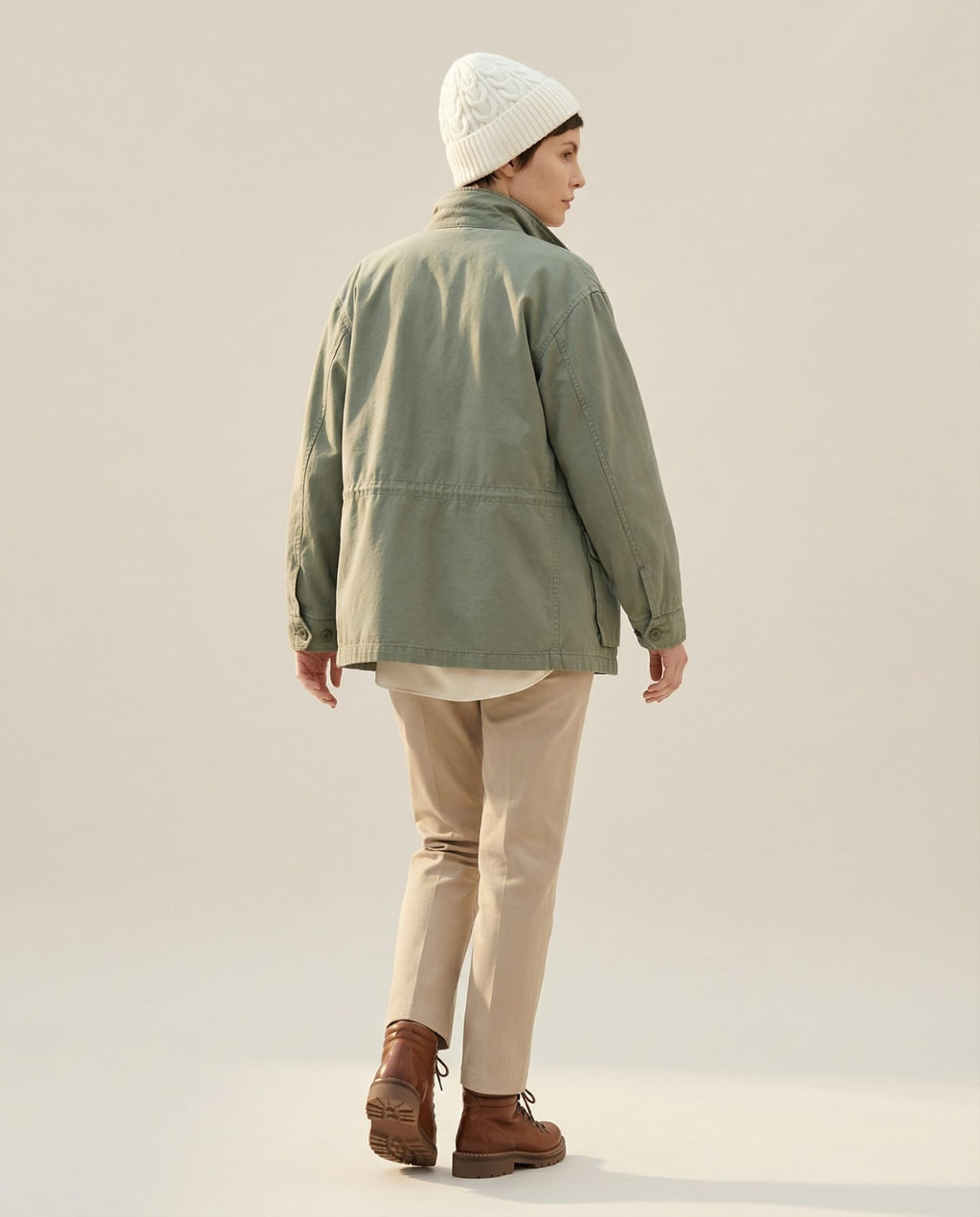 Color range overhead — oat, charcoal, fisherman cream cable-knit beanies