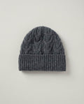 Side profile of Wildfool cable-knit beanie showing the slouchy crown