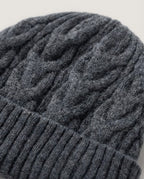 Macro close-up of the cable-knit twist pattern on 100% sheep wool