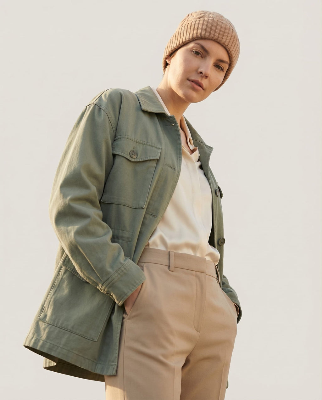 Wildfool cable-knit beanie draped over a fisherman sweater for context