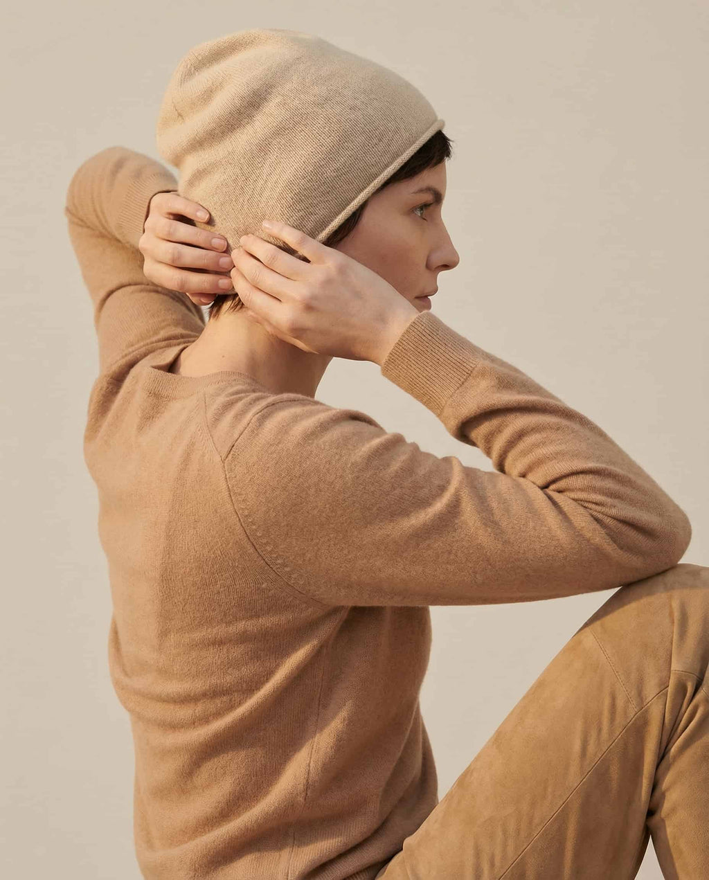 Back of head view — Wildfool Alashan cashmere beanie covering ears in winter light