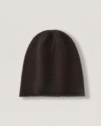 The Cashmere-Blend Cloud Beanie in Espresso, laid flat with a rolled edge