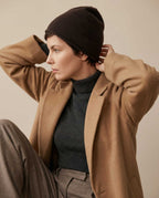 Wildfool Alashan cashmere beanie folded into a soft fold for travel