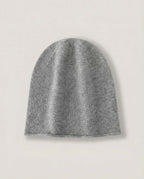 The Cashmere-Blend Cloud Beanie in Grey, laid flat with a rolled edge