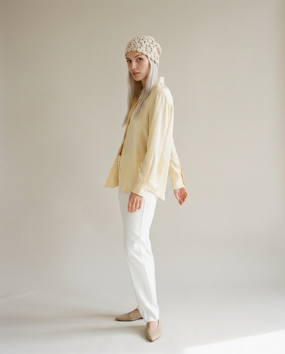 Hand holding the cashmere cloche to show its barely-there 80g weight