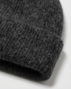 Inside-out shot of Alashan cashmere-blend beanie revealing the cashmere lining layer