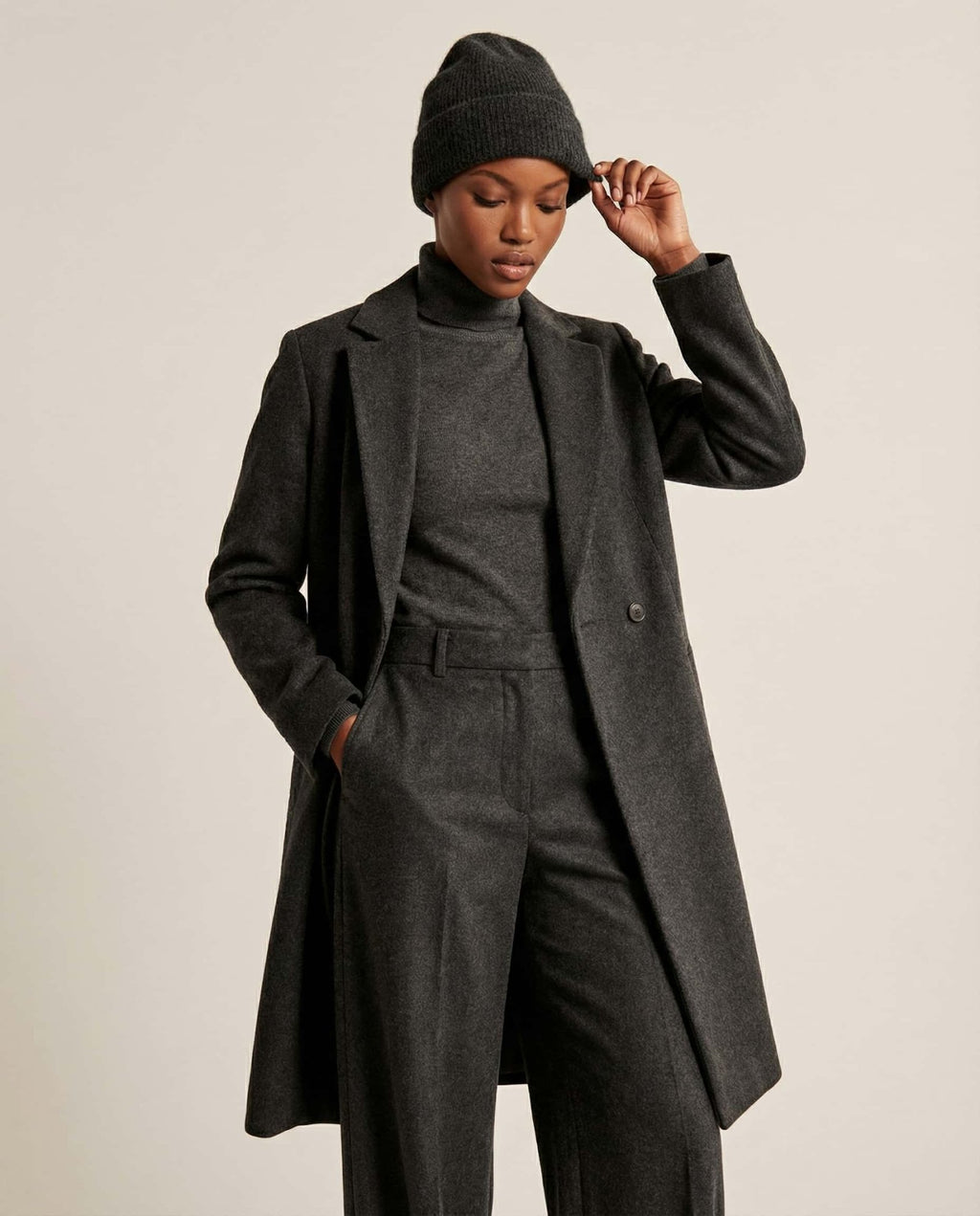 Alashan cashmere-blend beanie worn on model — three-quarter portrait in soft daylight