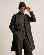 Alashan cashmere-blend beanie worn on model — three-quarter portrait in soft daylight
