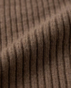 Wool hood on model with snow falling — winter lifestyle moment