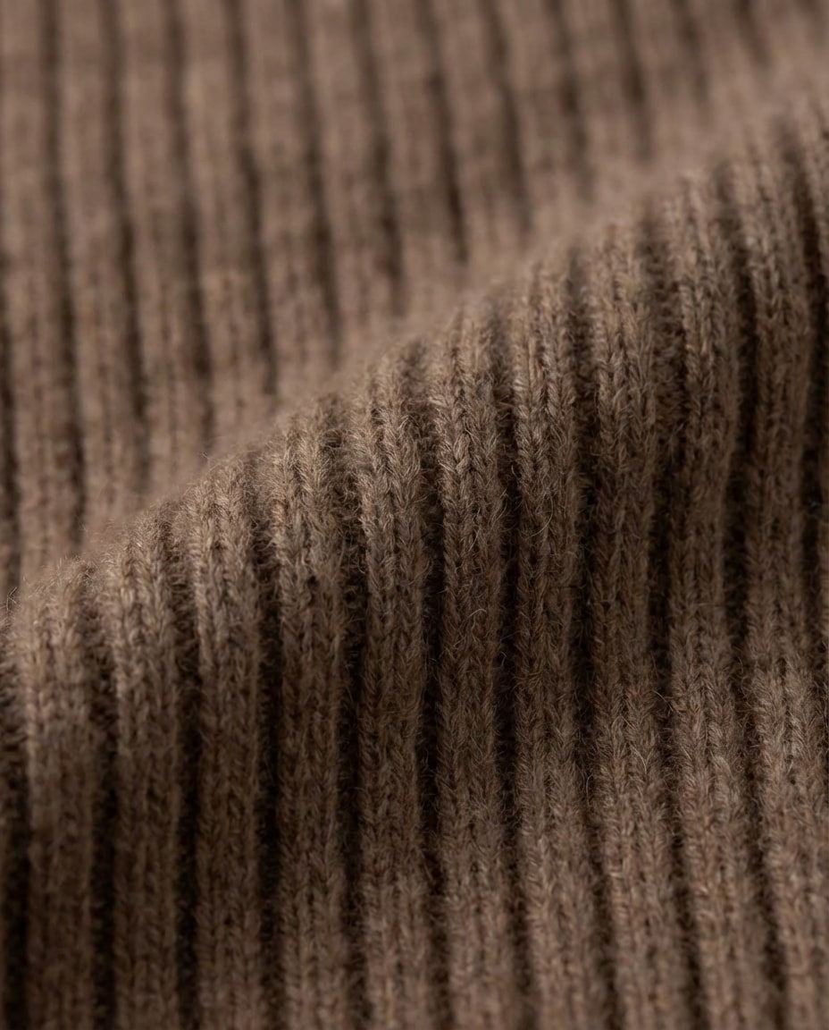 Wool hood on model with snow falling — winter lifestyle moment