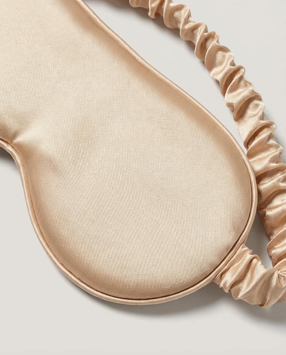 Wildfool 22-Momme Silk Blackout Mask in Champagne Gold - Zoom View - 100% Mulberry Silk, Friction-Free & Temperature Regulating Sleep Shield