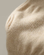 Close-up of undyed Alashan cashmere knit showing the natural fiber color variation
