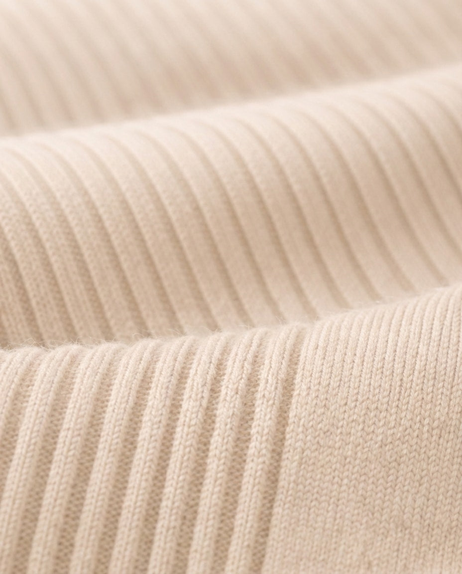 Macro of sheep wool blend knit surface showing the soft pile texture