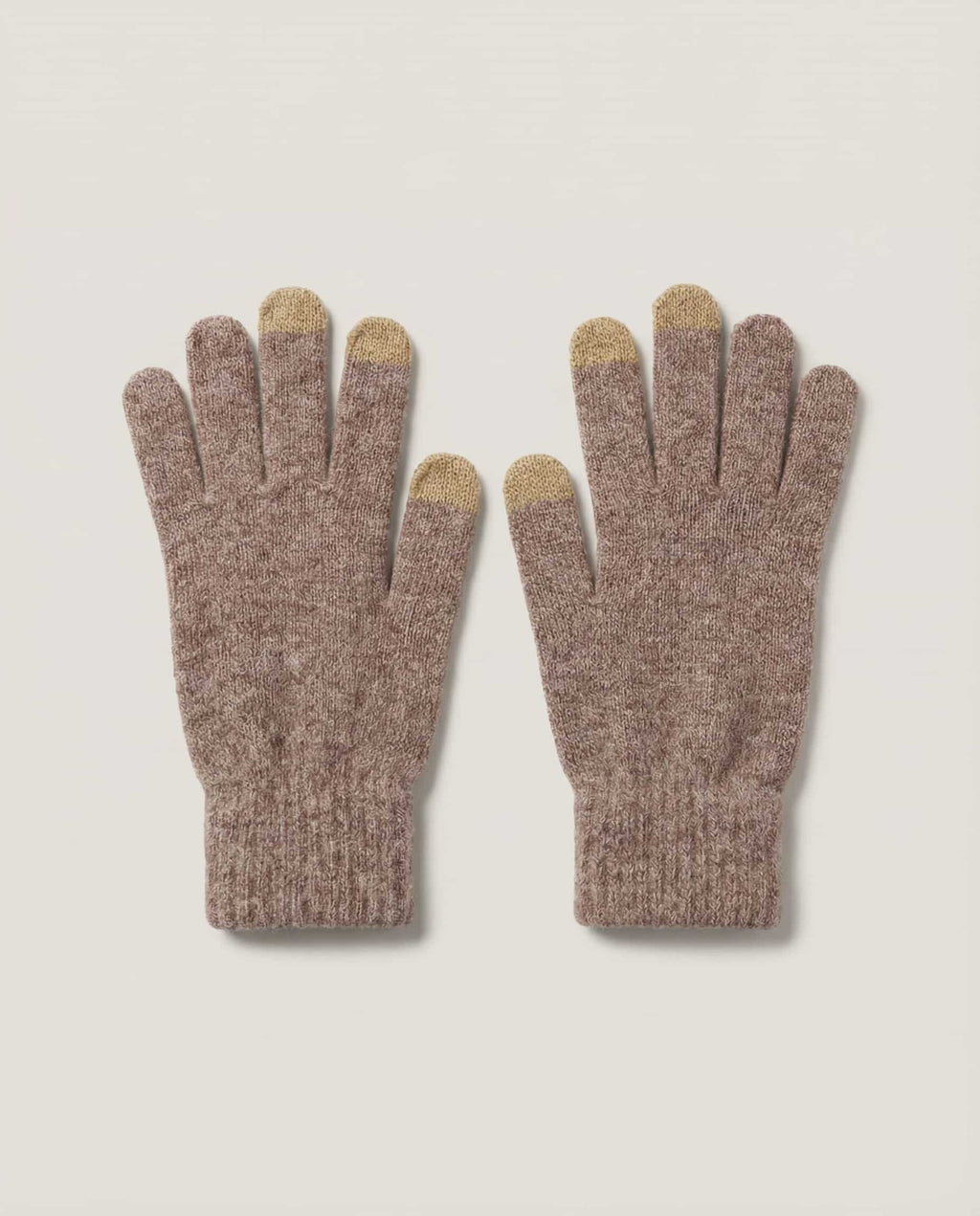 Macro close-up of conductive fiber woven into the fingertip of Wildfool tech glove