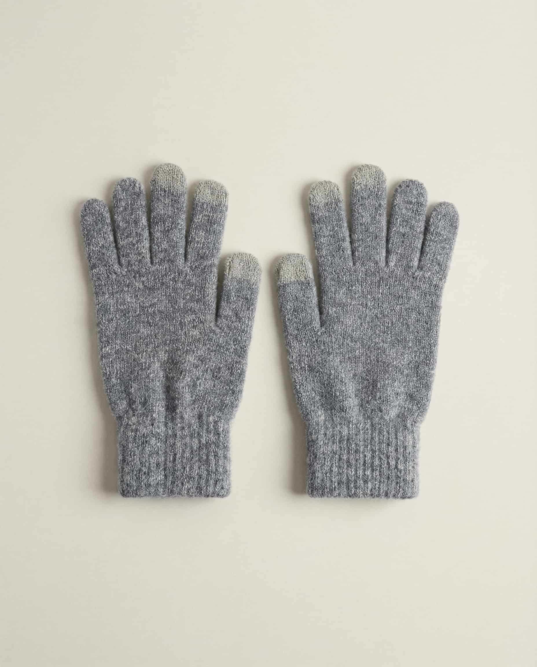 Both gloves laid flat showing the five-finger conductive design