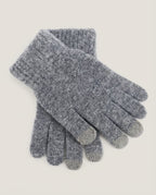 Wildfool tech gloves tucked into a coat pocket — commute lifestyle shot
