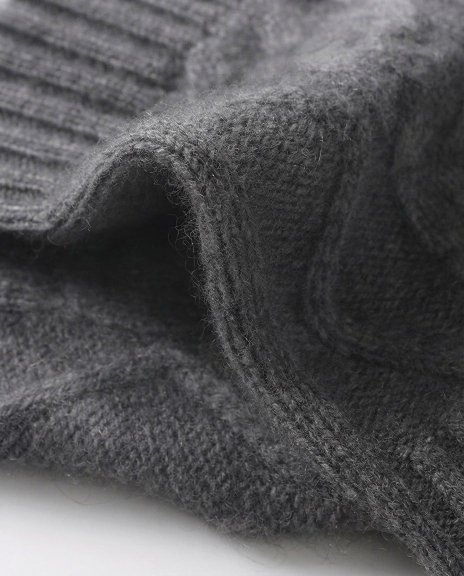 Macro close-up of the cable knit pattern on baby cashmere wrist warmer