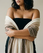 Wildfool undyed cable-knit cashmere shawl in natural melange — full flat lay on cream linen