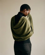 Wildfool Zibeline scarf beside its cedar moth block — care accessory detail