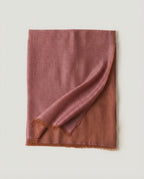 Satin wrap draped over bare shoulders — three-quarter portrait in evening light