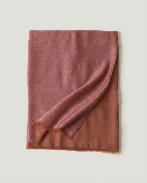 Satin wrap draped over bare shoulders — three-quarter portrait in evening light