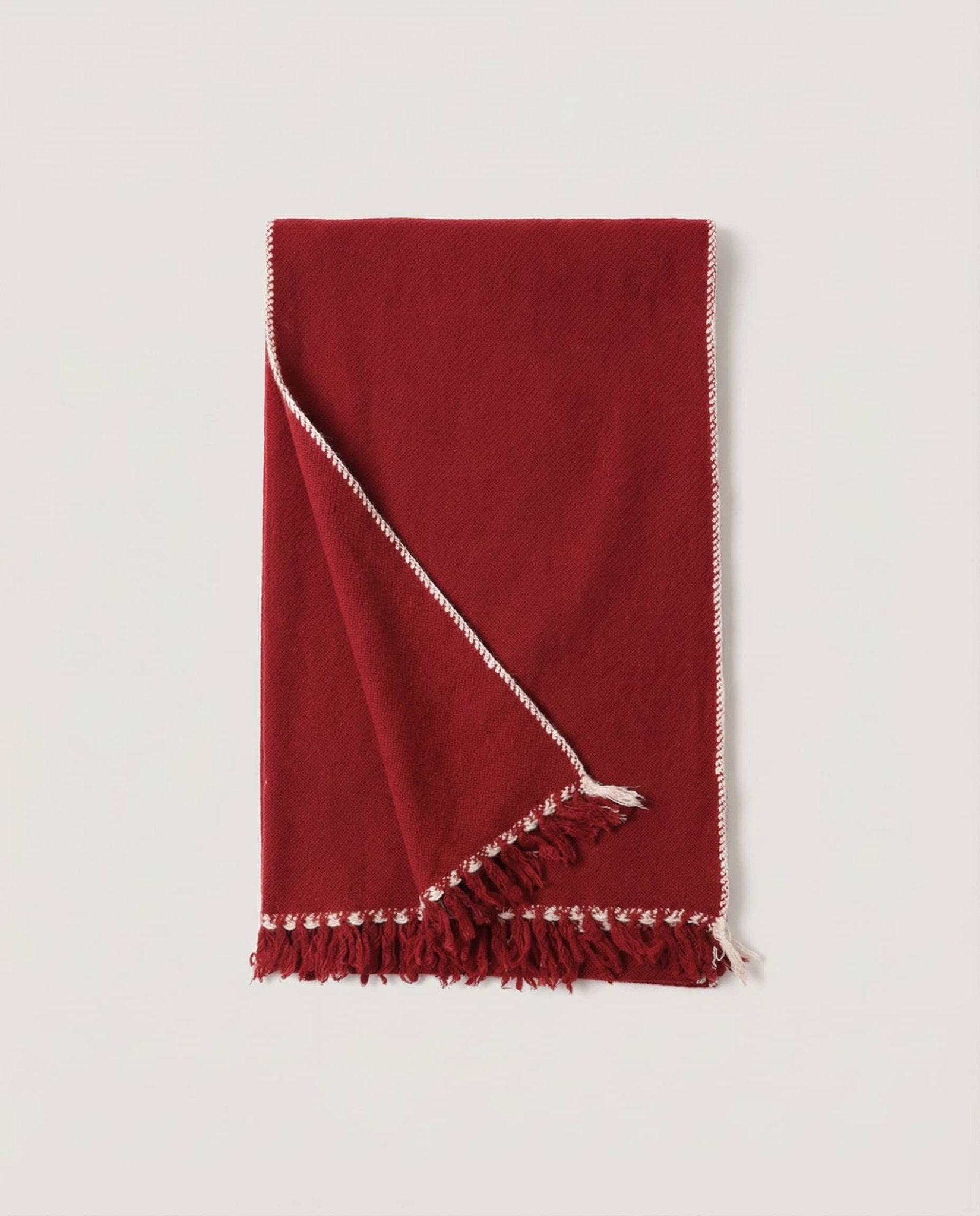 Wrap draped over both arms at full 200cm span — scale reference shot