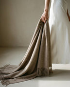 Detail of the selvedge edge on the nomad lambswool blanket-wrap