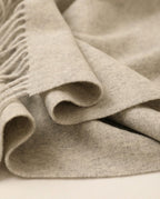 Wildfool nomad lambswool blanket-wrap in its branded canvas bag