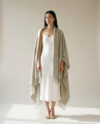 Wildfool blanket-wrap worn over a denim jacket — layering lifestyle shot