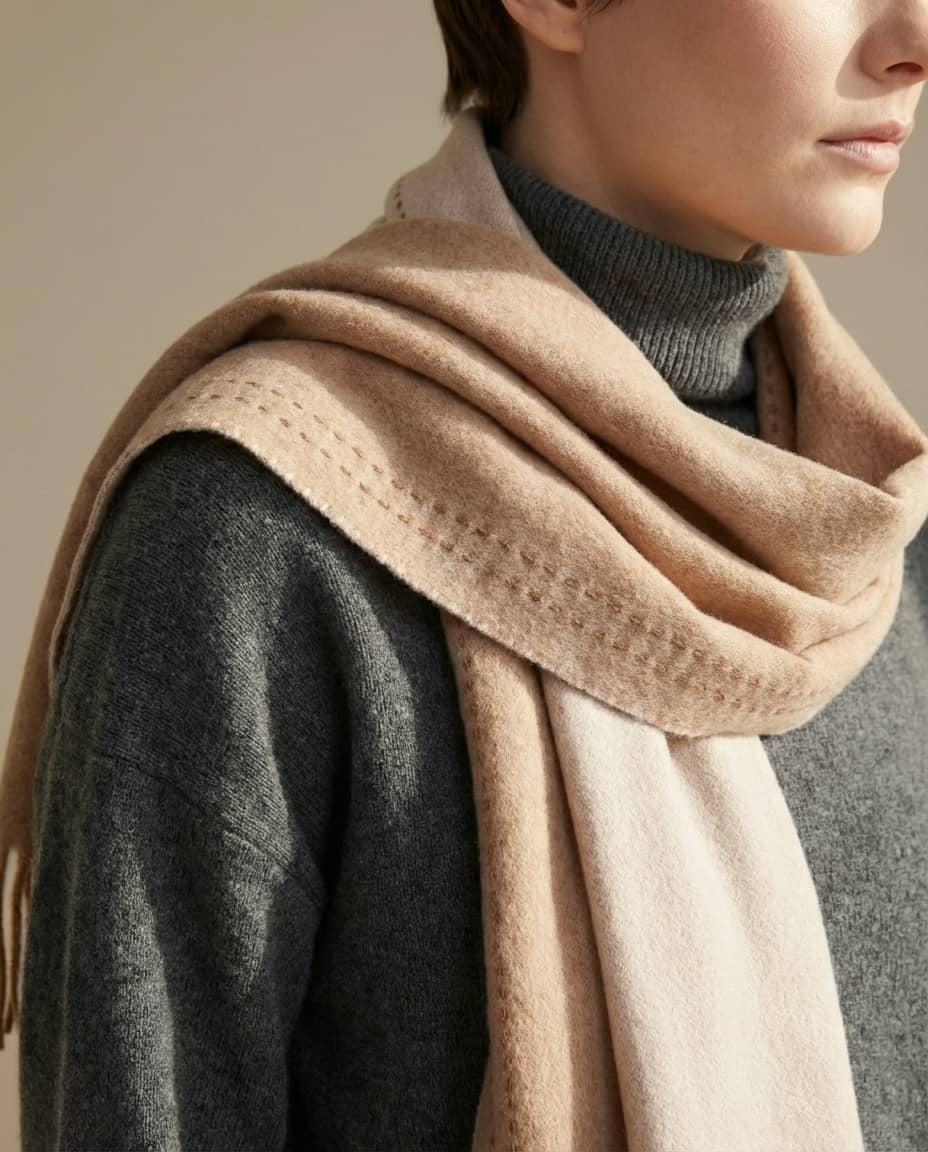 Scarf worn tucked under a collar with oat side out — office styling shot