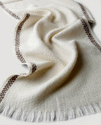 Detail of the woven contrast edge running along the full length of the scarf