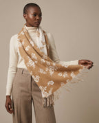 Jacquard scarf flipped to reverse — dark blooms on light field showing both faces