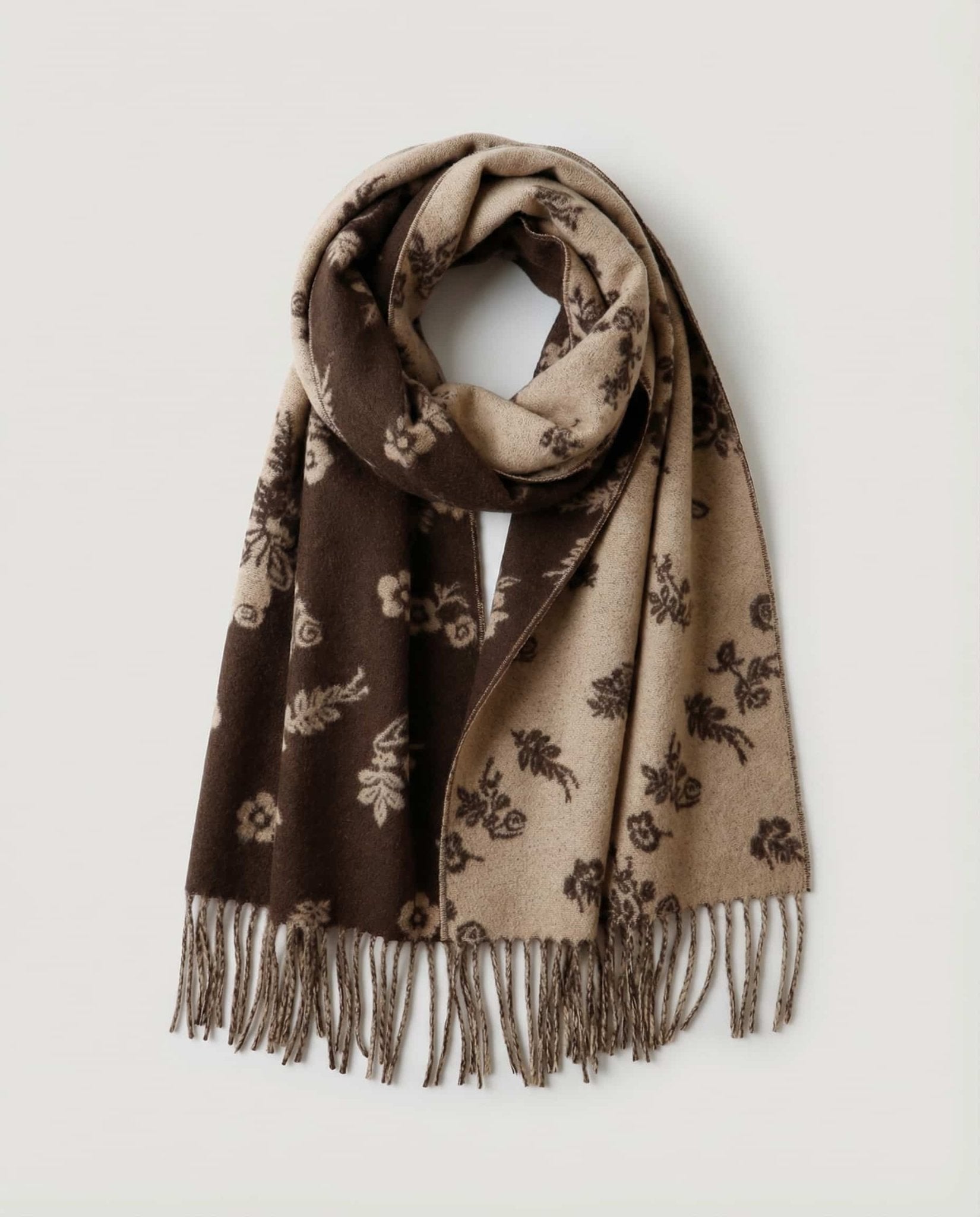 Wildfool wildflower scarf draped over a leather jacket — styling contrast shot