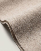 Scarf draped over the back of a wooden chair — still life