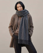 Scarf worn twisted once at the neck — casual styling detail