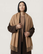 Wildfool slim scarf looped once through the collar of a blazer — office styling