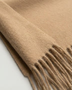 Detail of the soft fringe edge on Wildfool superfine wool scarf