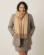 Wildfool brushed scarf folded on a wooden shelf — still life