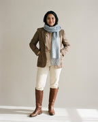 Brushed lambswool scarf wrapped twice around the neck — front portrait in winter light