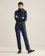 Cashmere-knit collar worn tucked under a tailored jacket — front view portrait