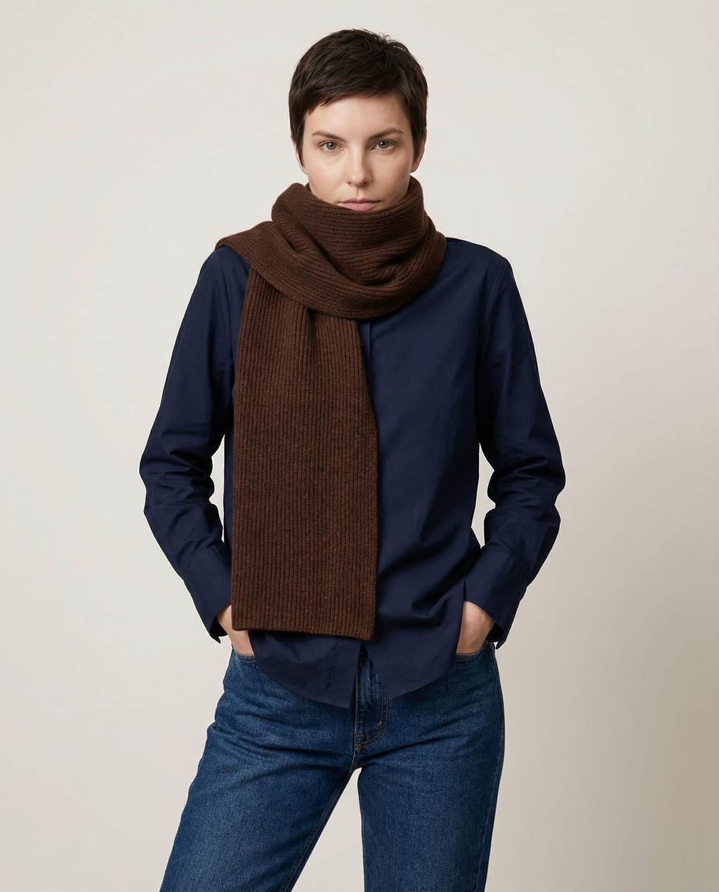 Wildfool knit collar being slipped over the head — quick-on demo shot