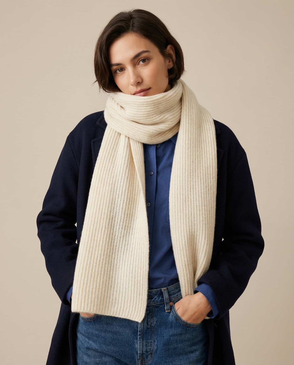 Wildfool cashmere-knit collar rolled into a compact tube for pocket carry