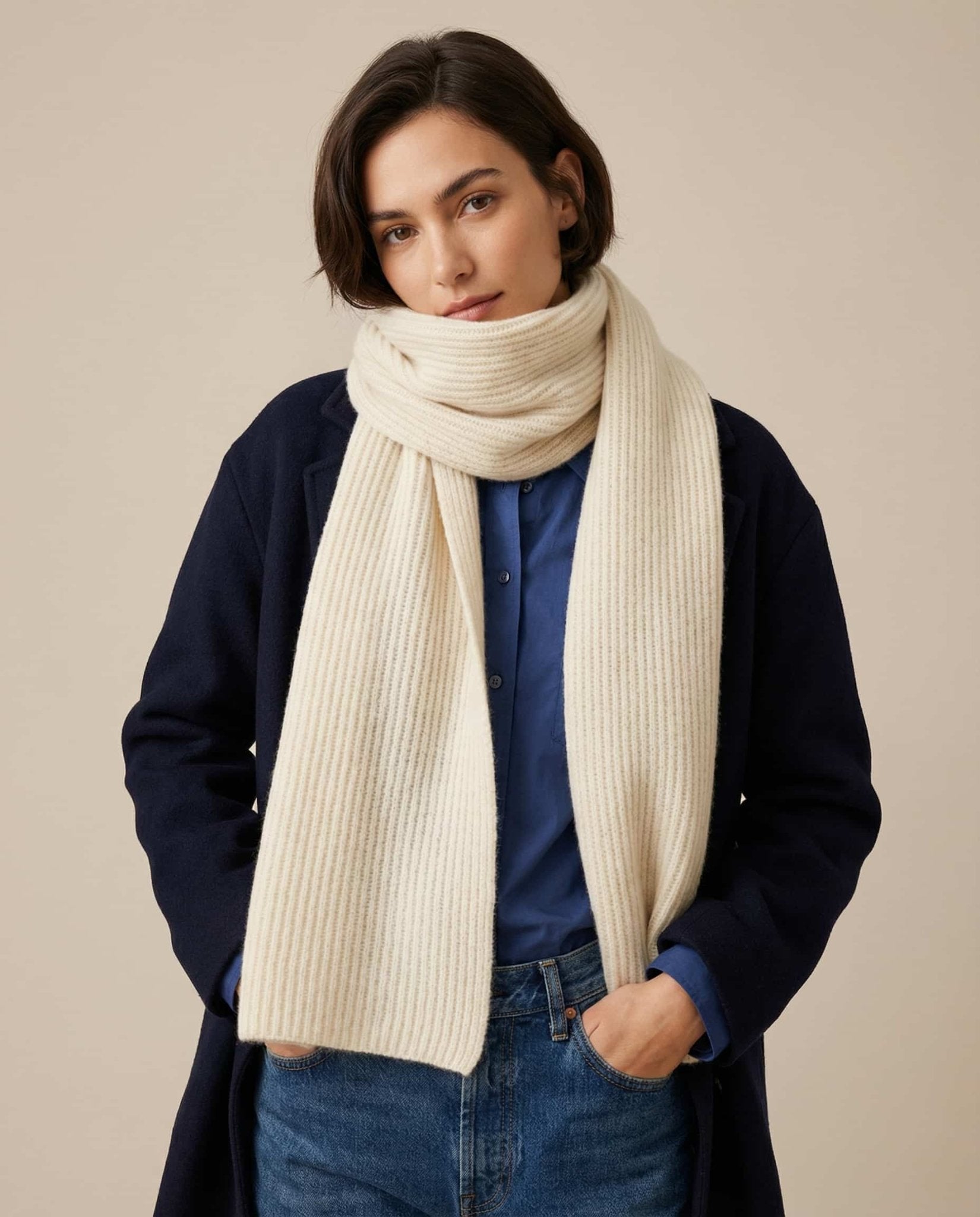 Wildfool cashmere-knit collar rolled into a compact tube for pocket carry