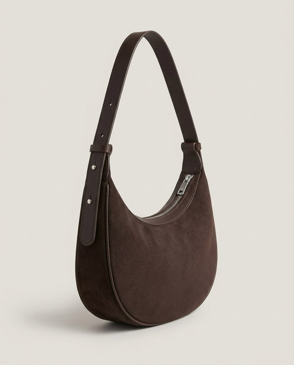 Cassis Crescent Bag profile — slim 7 cm side with edge piping